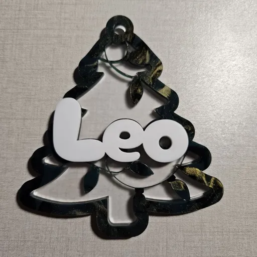 Christmas tree ornament made with frosted acrylic, green marble acrylic, and white acrylic